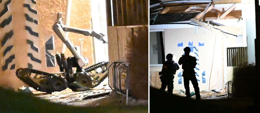 Polisens bombrobot arbetar vid en entré till ett lägenhetshus i Borås.