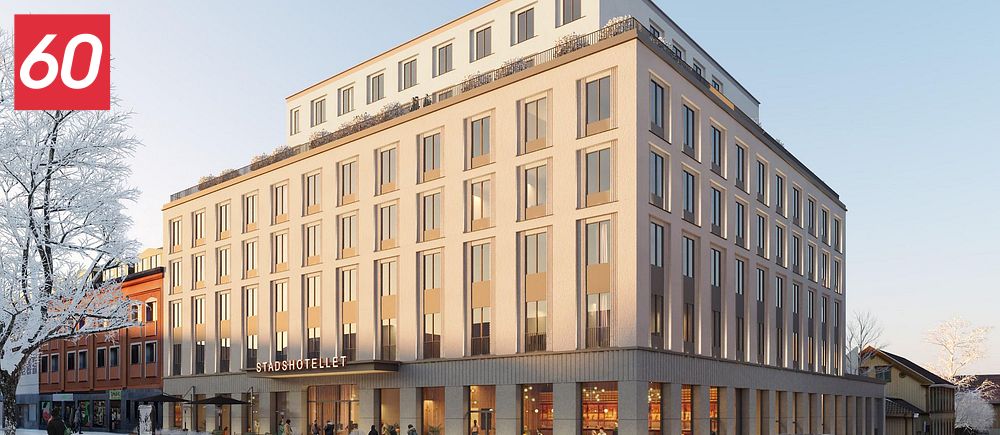 Nybyggt hotell med modern arkitektur i stadsmiljö en vintrig dag.