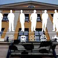 Silhuetter av människor och transportsymboler mot en byggnad.