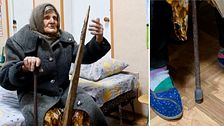 Lidia Stepanivna Lomikovska sitter på en säng i Ukraina efter att ha flytt ryska anfall