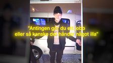 En man står framför en bil, texten hotar med att något illa kan hända.