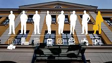 Silhuetter av människor och transportsymboler mot en byggnad.