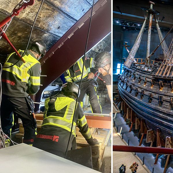 Fyra personer skruvar fast en stor stålkonstruktion som ska stötta upp Vasaskeppet.