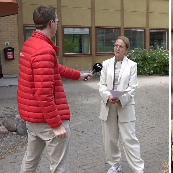 en reporter i röd jacka intervjuar en kvinna i vit kostym, samt en man i grön jacka och kort hår.