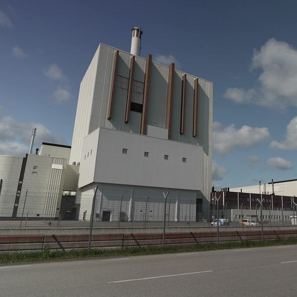 Ett kärnkraftverk som reser sig mot en blå himmel.