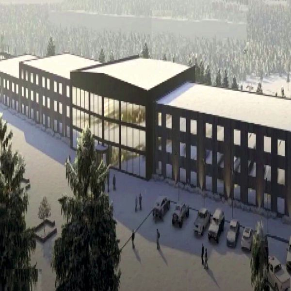 Skiss över ett hotell i vinterlandskap med parkeringsplatser framför byggnaden.
