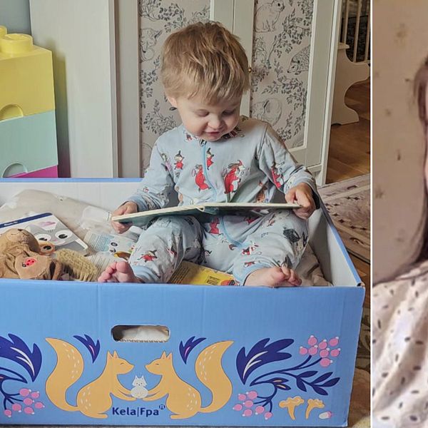 Johanna Hautamäen poika istuu lukeamssa kirjaa äitiyspakkauslaatikossa.