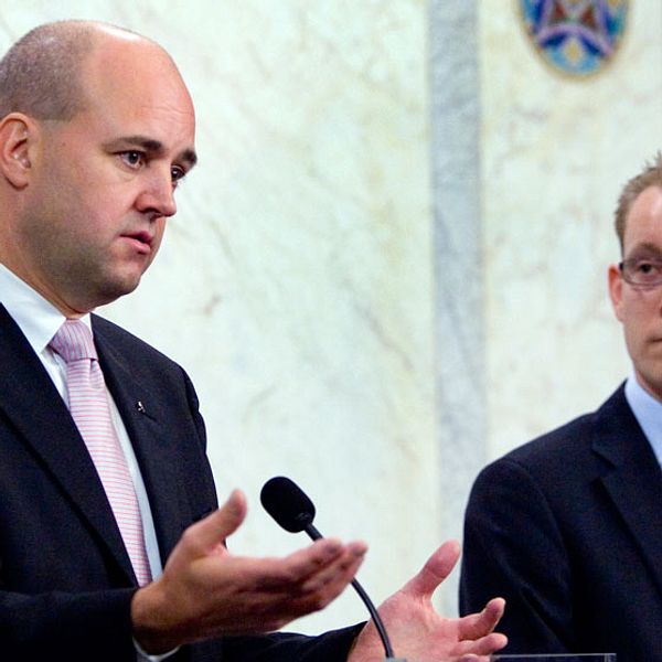 Fredrik Reinfeldt och Tobias Billström.