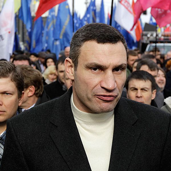 Lawmaker and chairman of the Ukrainian opposition party Udar (Punch), WBC Heavyweight Champion boxer Vitali Klitschko, center, attends a rally in front of parliament building in Kiev, Ukraine, Tuesday, April 2, 2013. Several thousand demonstrators rallied in the center of Kiev to demand a mayoral election and to complain that the city was slow to clean up after last month's heavy blizzard that paralyzed the Ukrainian capital. (AP Photo/Sergei Chuzavkov)