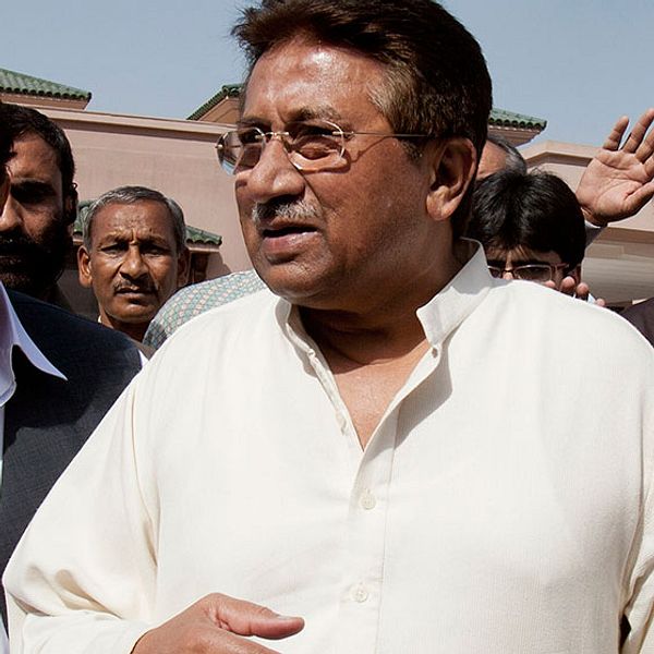 In this Monday, April 15, 2013 photo, Pakistan's former President and military ruler Pervez Musharraf arrives under tight security to address his party supporters at his house in Islamabad, Pakistan. Musharraf and his security team pushed past policemen and sped away from a court in the country s capital on Thursday after his bail was revoked in a case in which he is accused of treason. (AP Photo/B.K. Bangash)