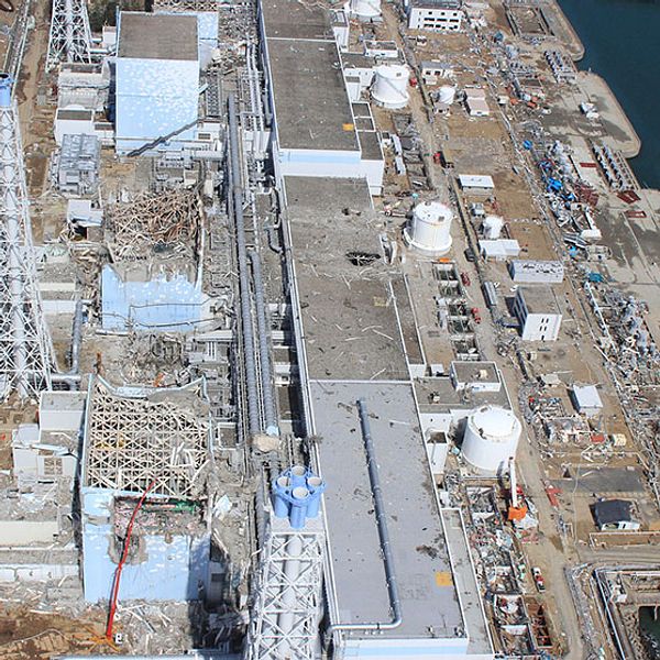 FILE – In this March 24, 2011 aerial photo taken by small unmanned drone and released by AIR PHOTO SERVICE, the crippled Fukushima Dai-ichi nuclear power plant is seen in Okuma, Fukushima prefecture, northern Japan. From top to bottom, Unit 1 through Unit 4. Japan s government said Wednesday, Aug. 7, 2013, it will step in to tackle contaminated water leaks at the country s crippled nuclear plant, and is considering funding a multibillion-dollar project to fix the problem. (AP Photo/AIR PHOTO SERVICE, FILE) MANDATORY CREDIT