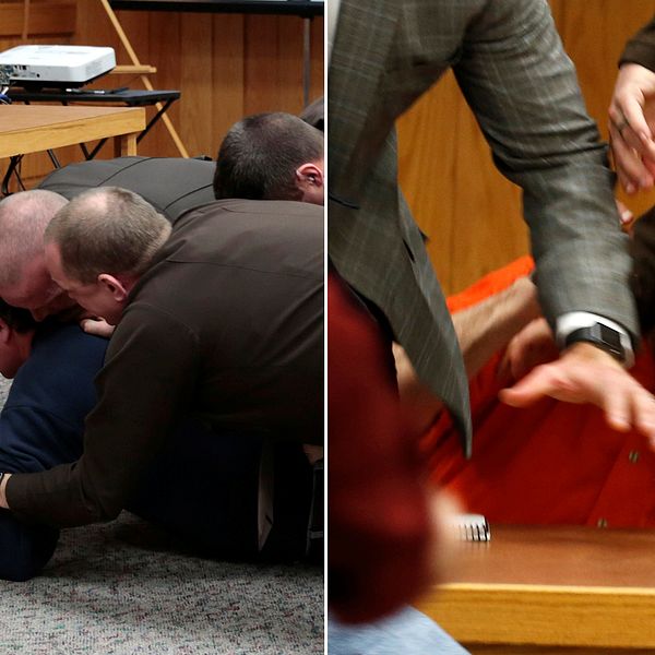 Larry Nassar, i orange dräkt, attackerades av ett av offrens pappa i rättssalen. Till vänster i bild hålls pappan ner av poliser.