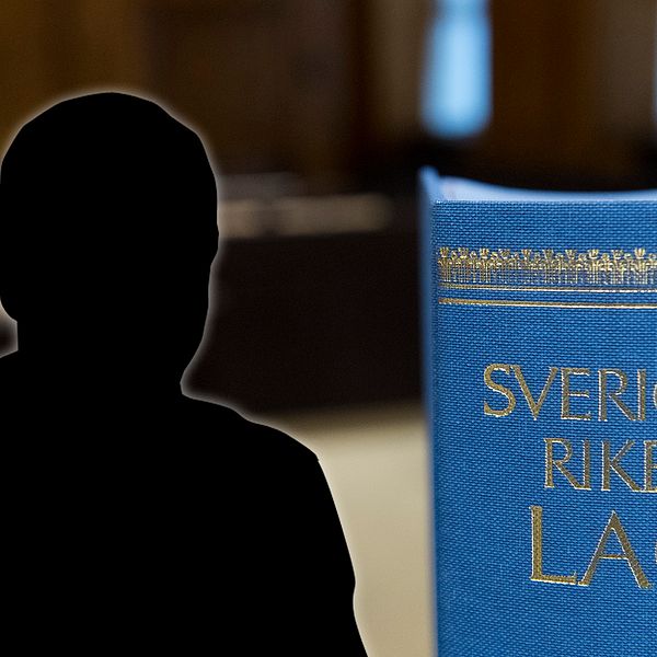 Silhuett av man samt en lagbok.