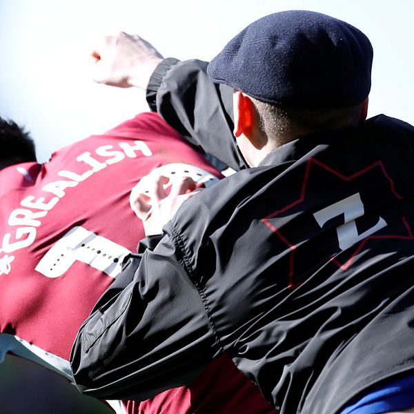 En huligan attackerade och slog till Aston Villas kapten Jack Grealish i derbyt mot Birmingham.
