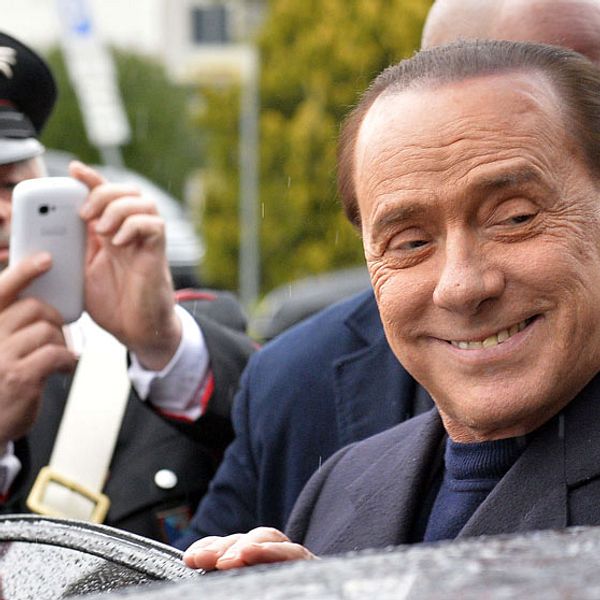 (FILES) – In this file picture taken on March 25, 2014, former Italian Prime Minister Silvio Berlusconi arrives at the Ciampino Airport. An Italian appeal court on July 18, 2014 acquitted former prime minister Silvio Berlusconi of charges of having sex with an underage prostitute and abuse of power. 'The defendant is acquitted,' presiding judge Enrico Tranfa said, rejecting a request from prosecutors to confirm a seven-year sentence against the billionaire tycoon. AFP PHOTO / ANDREAS SOLARO