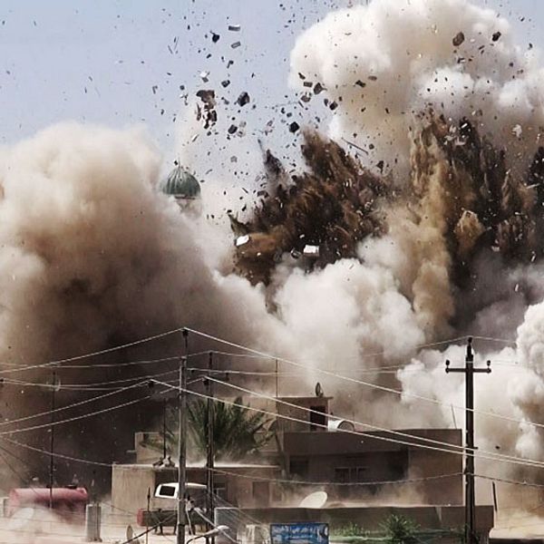 In this undated photo posted on a militant website that frequently carries official statements from the Islamic State extremist group, which has been verified and is consistent with other AP reporting, smoke and debris go up in the air as Shiite's Al-Qubba Husseiniya mosque explodes in Mosul, Iraq. Images posted online show that Islamic extremists have destroyed at least 10 ancient shrines and Shiite mosques in territory – the city of Mosul and the town of Tal Afar – they have seized in northern Iraq in recent weeks. (AP Photo)