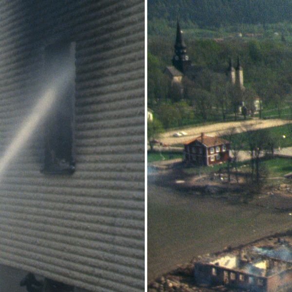 Flygbild över Varnhem 1979 med många nedbrända byggnader och brandman som bekämpar elden