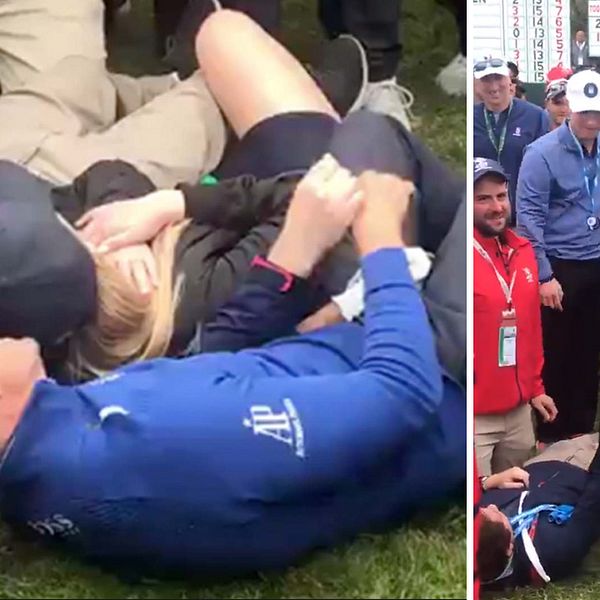 Henrik Stenson tar en liggande selfie med en åskådare han råkat sänka med ett golfslag.