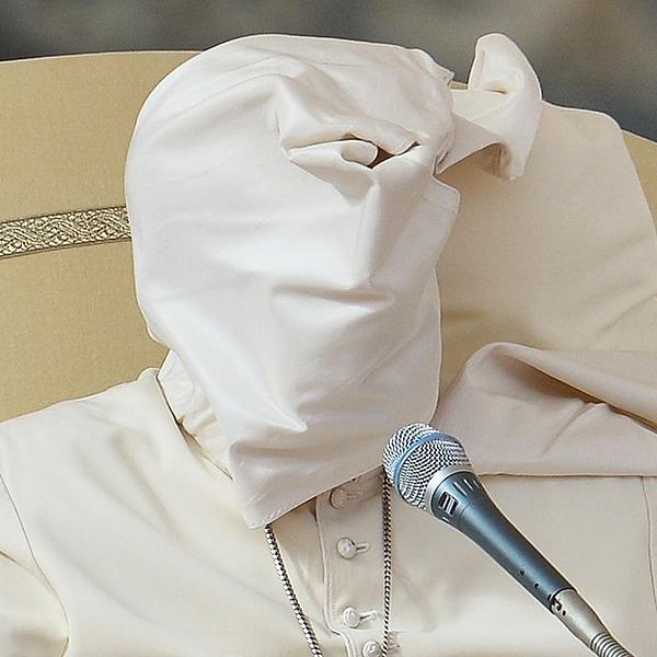 The pellegrina of Pope Francis is lifted by a gust of wind during his weekly general audience at St Peter's square on November 5, 2014 at the Vatican.