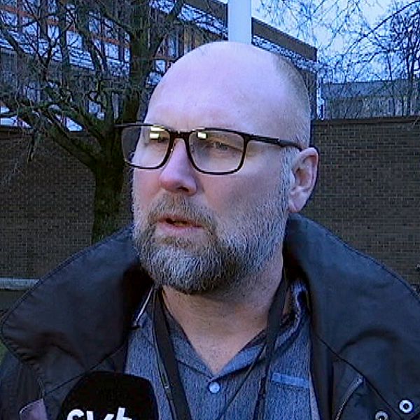 Jan Ekholm, med skägg och glasögon.