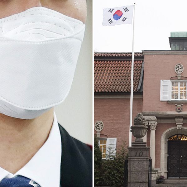 Man med munskydd och Sydkoreas ambassad på Laboratoriegatan i Stockholm.