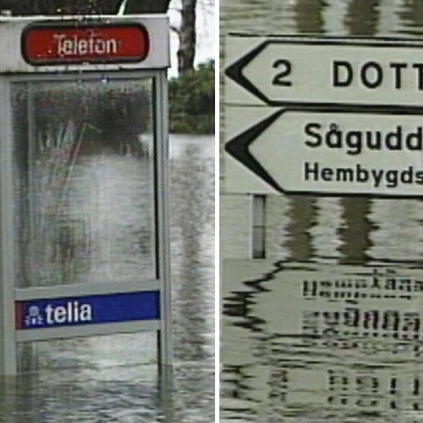 En telefonkiosk till hälften täckt av vatten samt en vägskylt som pekar mot Dottevik och Sågudden, också den med vatten en bra bit upp.