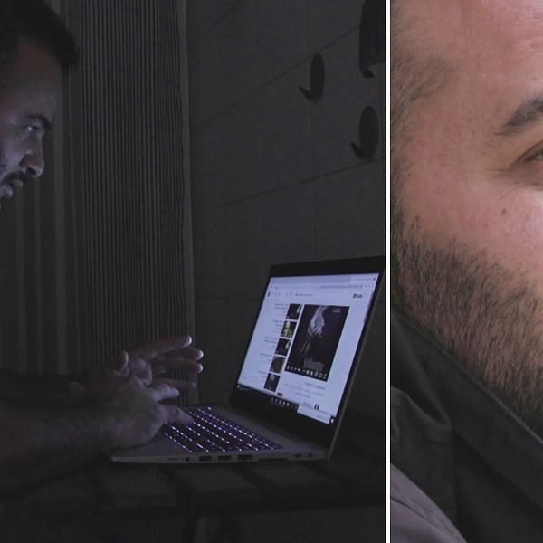 En man sitter i ett mörkt rum vid en dator