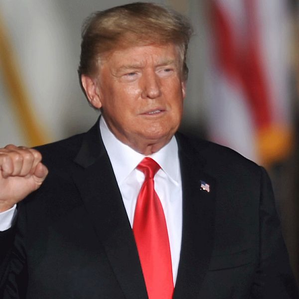 epa09515992 Former US President Donald J. Trump gestures to supporters at a Save America rally at the Iowa State Fairgrounds in Des Moines, Iowa, USA, 09 October 2021. The rally highlights Trumps first visit to Iowa since the general election in November 2020. EPA/STEVE POPE