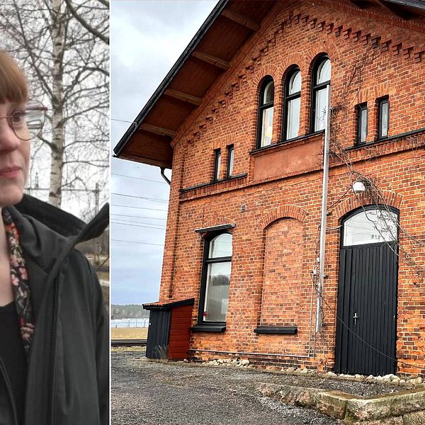 En kvinna med glasögon och gamla stationshuset i rött tegel.