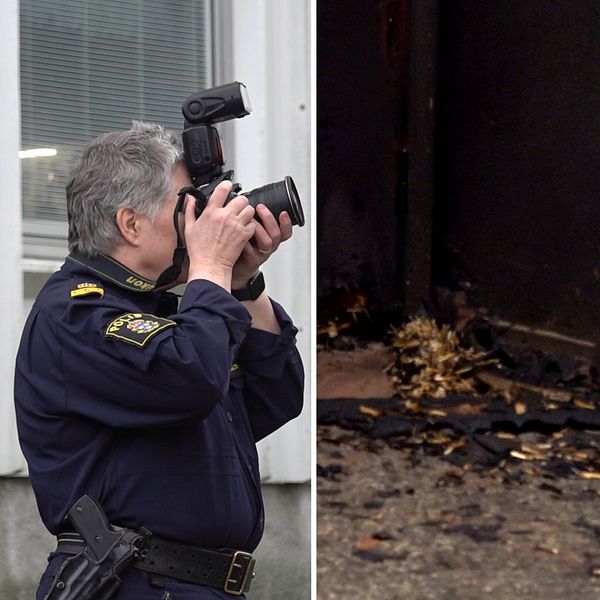 En polis fotograferar med en kamera, en annan polis tittar uppåt.