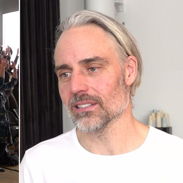en man och en folkmassa som gör rörelser