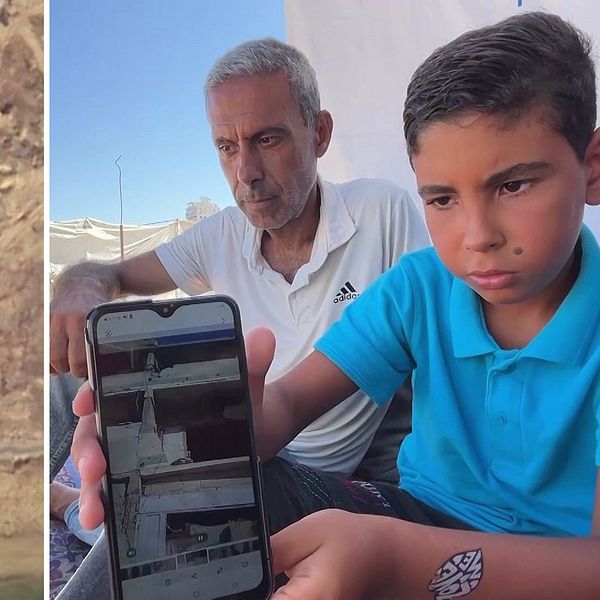 Palestinsk pojke visar mobil vid tältläger i Gaza, med vuxen man i bakgrunden