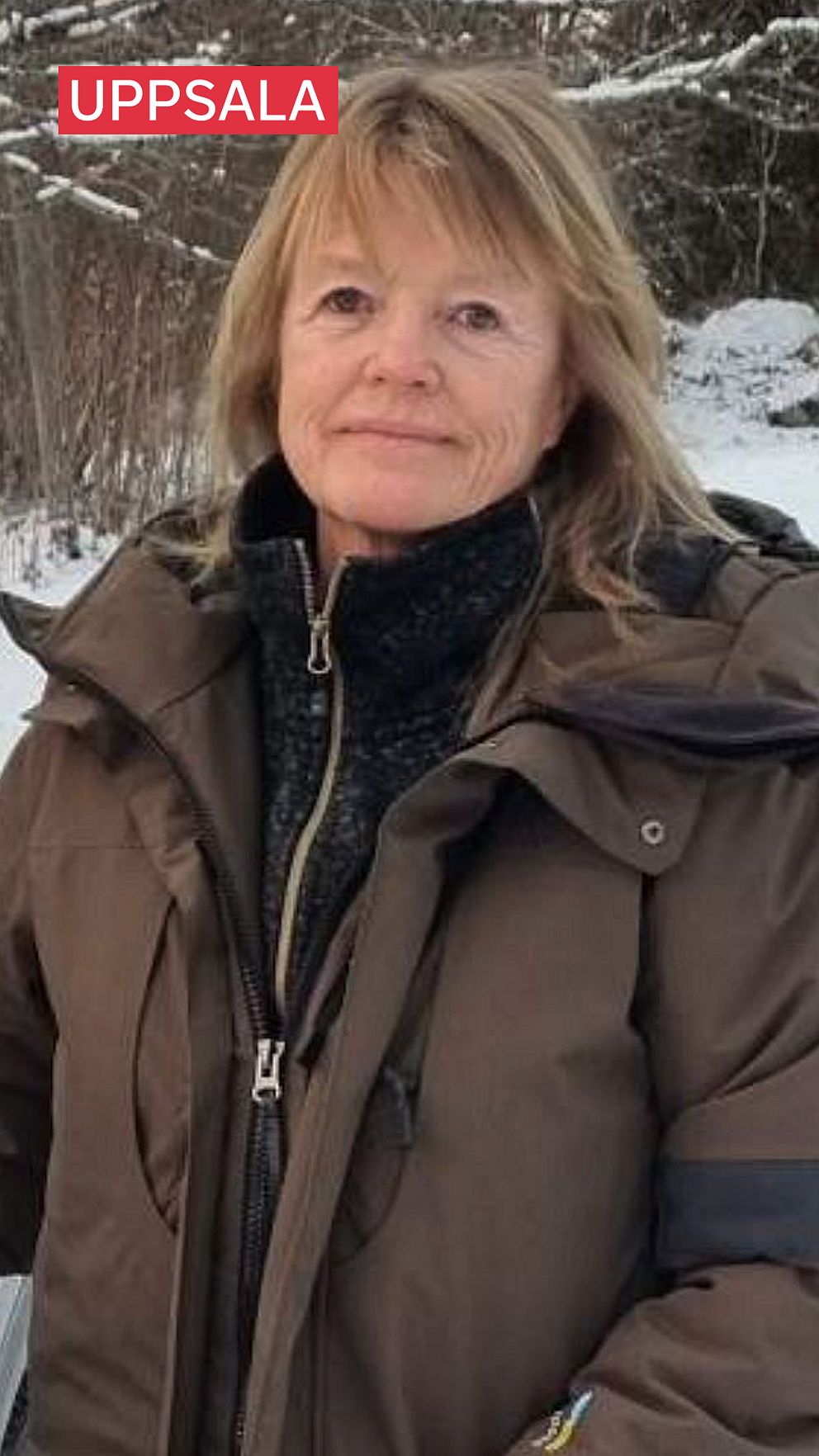 Tarja Hellberg i vinterjacka, lite snö i bakgrunden.