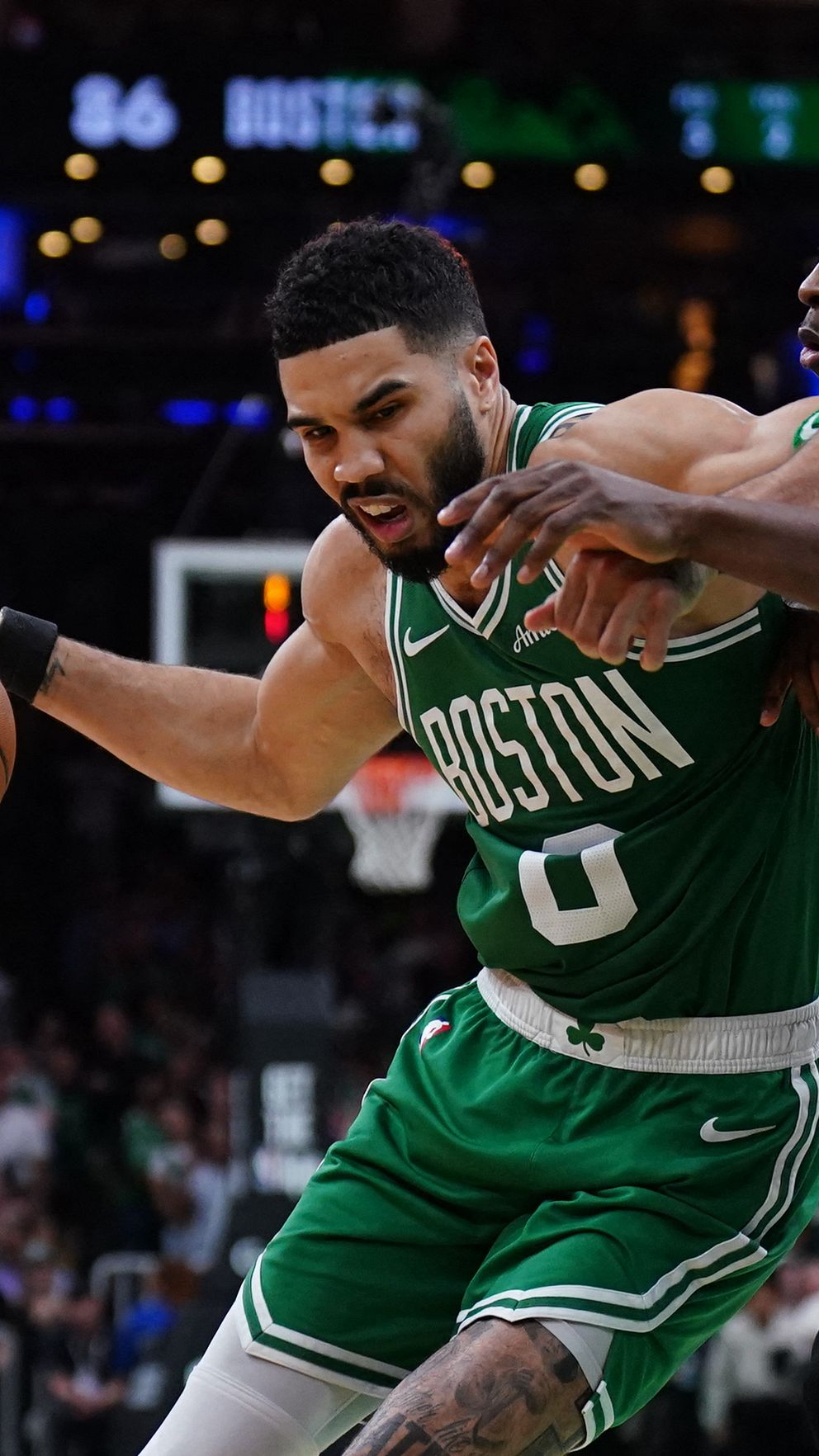 Boston, Massachusetts, USA; New York Knicks forward OG Anunoby (8) defends against Boston Celtics forward Jayson Tatum (0)