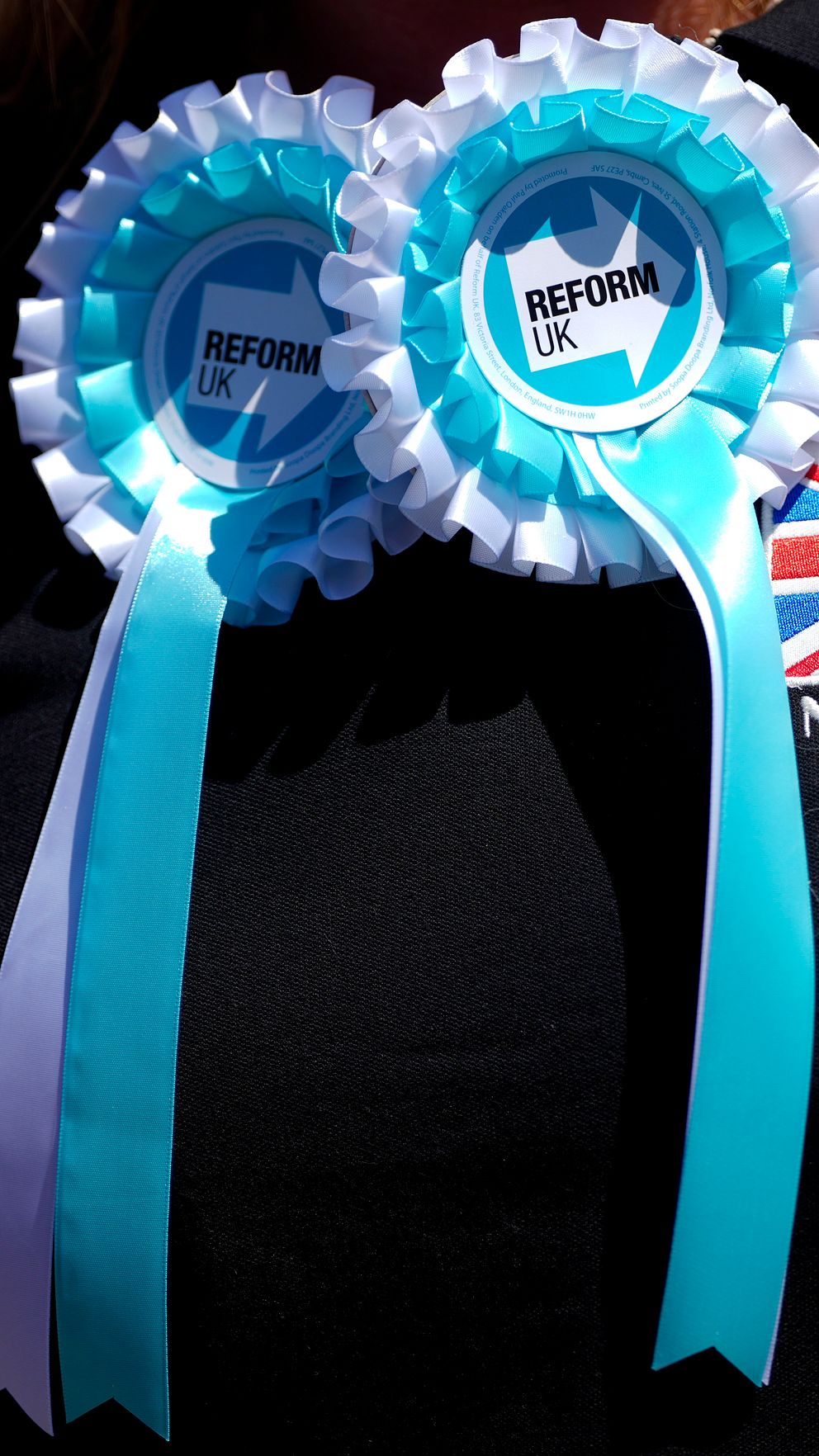 Partiet Reform UK:s logga på en tröja.