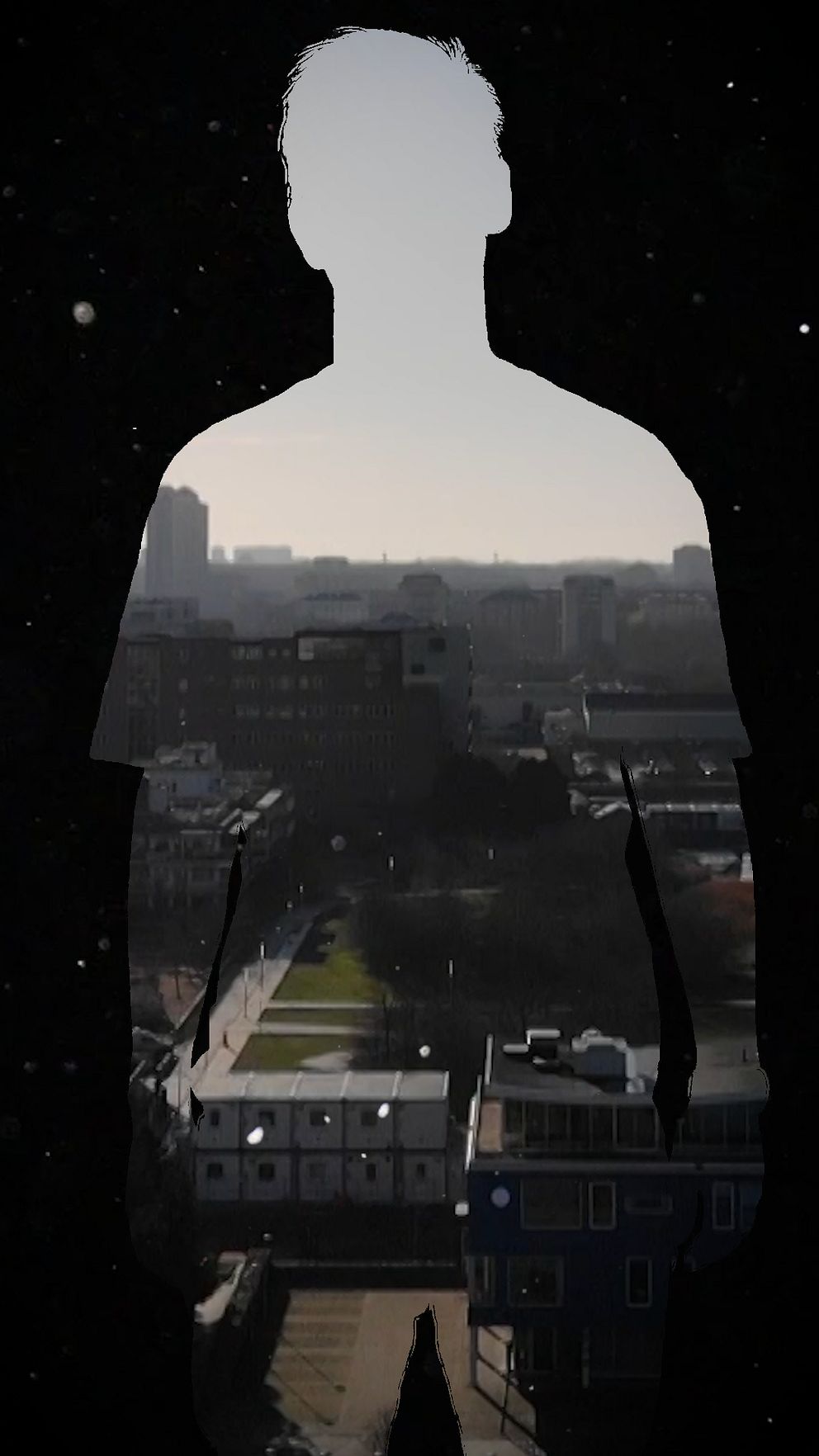 Silhuett av man med en vy över Malmö.