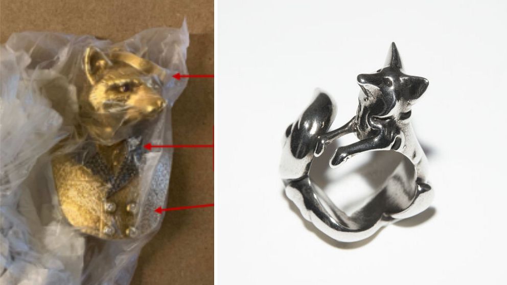 Ett guldsmycke i form av en räv till vänster, och ett silversmycke i form av en räv till höger.