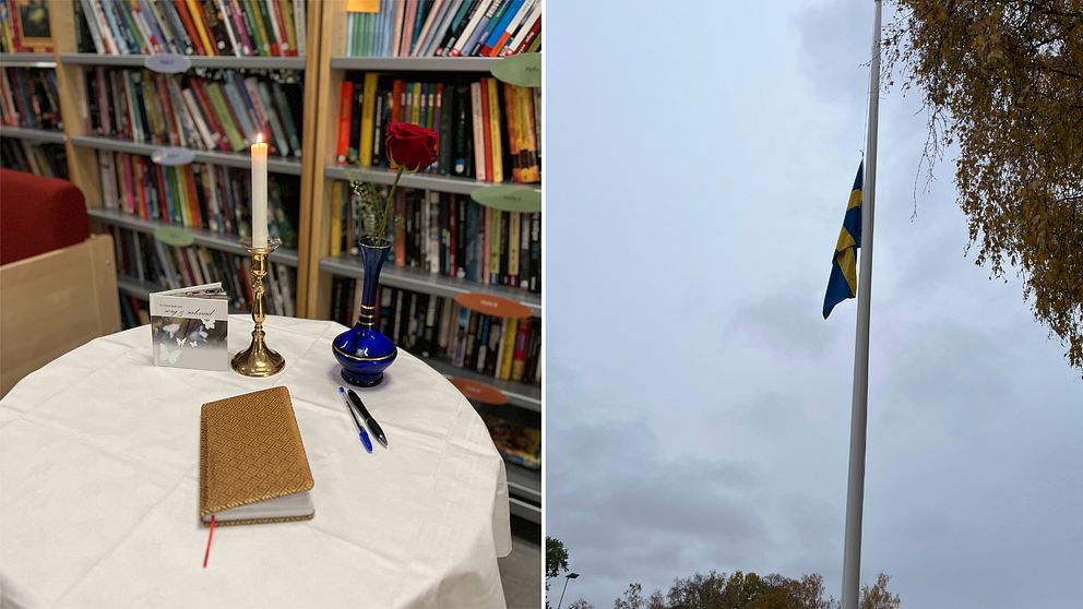 En flagga på halv stång samt ett runt bord med en ros, ett tänt ljus och en minnesbok.
