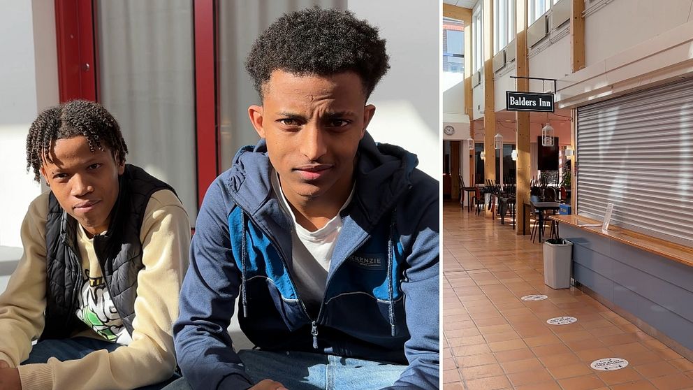Två elever i jeans, jacka och väst på en skola där en kafeteria håller stängt.
