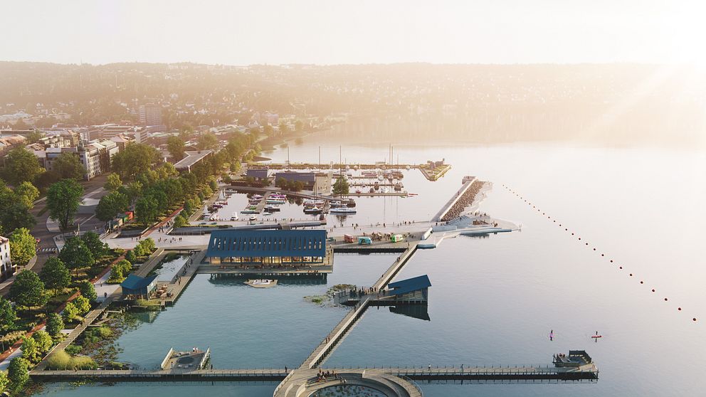 Förslag på hur hamnpiren i Jönköping kan se ut. Bilden är från ovan och visar en lång pir som går ut i vattnet, med en stor byggnad i mitten.