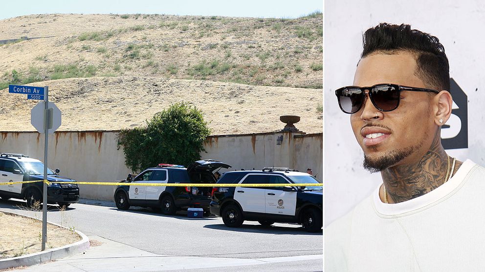 Chris Brown är omringad av polis utanför sitt hem i San Fernando Valley, Los Angeles.