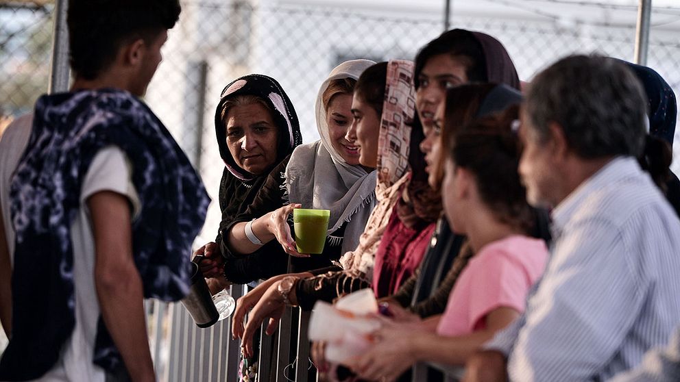 Flyktingar på ett läger på den grekiska ön Lesbos.