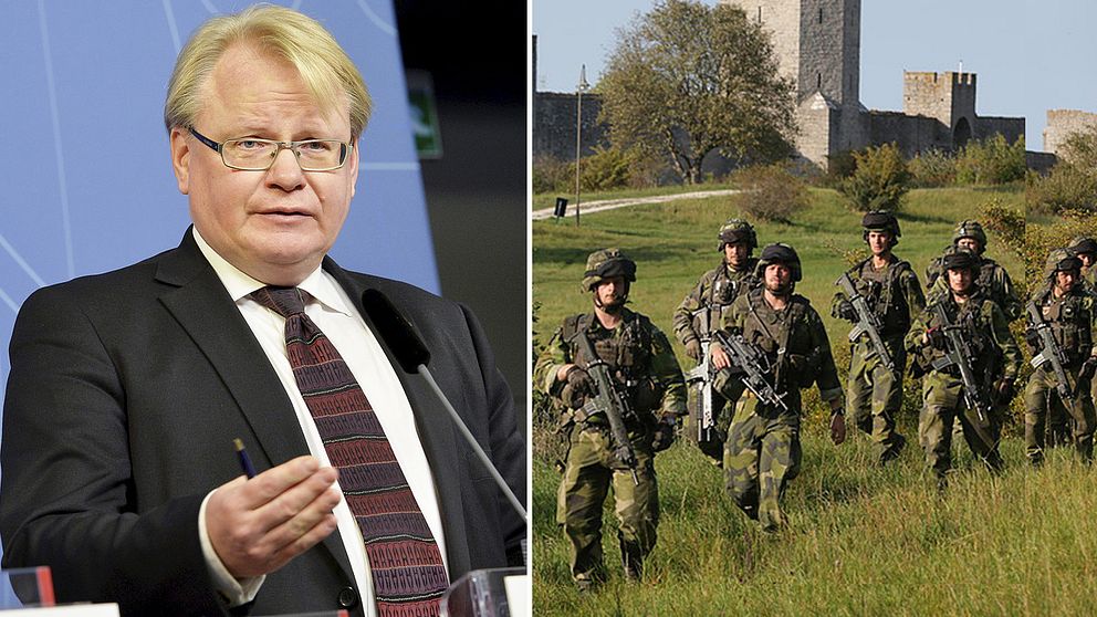 Försvarsminister Peter Hultqvist och en grupp värnpliktiga.