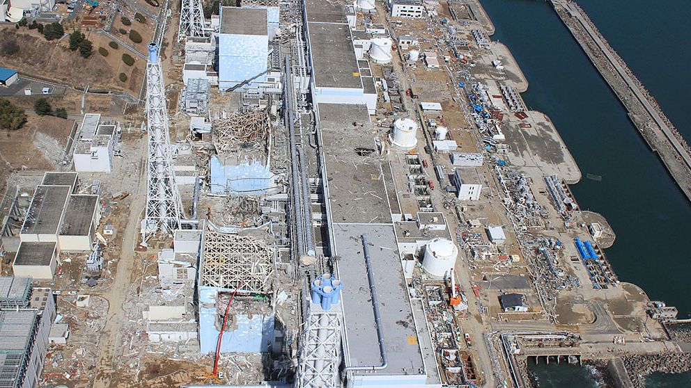 FILE – In this March 24, 2011 aerial photo taken by small unmanned drone and released by AIR PHOTO SERVICE, the crippled Fukushima Dai-ichi nuclear power plant is seen in Okuma, Fukushima prefecture, northern Japan. From top to bottom, Unit 1 through Unit 4. Japan s government said Wednesday, Aug. 7, 2013, it will step in to tackle contaminated water leaks at the country s crippled nuclear plant, and is considering funding a multibillion-dollar project to fix the problem. (AP Photo/AIR PHOTO SERVICE, FILE) MANDATORY CREDIT