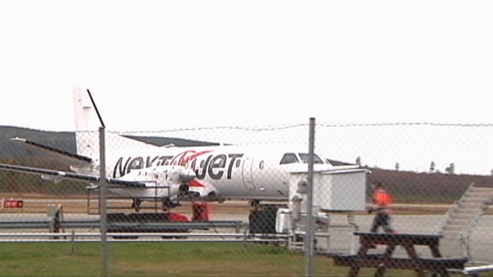 flygplan märkt Nextjet på landningsbana