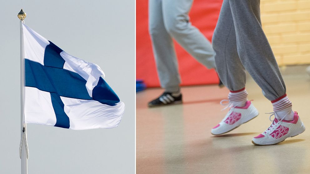 Finlands flagga och skolbarn som springer. Arkivbild.