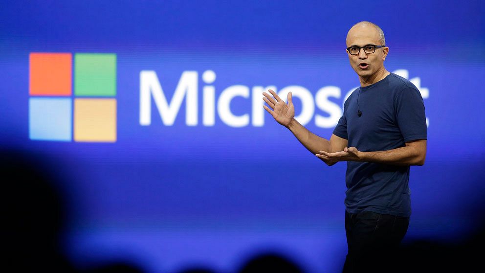 CORRECTS TO SAY THAT MICROSOFT WILL ELIMINATE UP TO 18,000 INSTEAD OF 18,000 – FILE – In this April 2, 2014 file photo, Microsoft CEO Satya Nadella gestures during the keynote address of the Build Conference in San Francisco. Microsoft on Thursday, July 17, 2014 announced it will lay off up to 18,000 workers over the next year. (AP Photo/Eric Risberg, File)