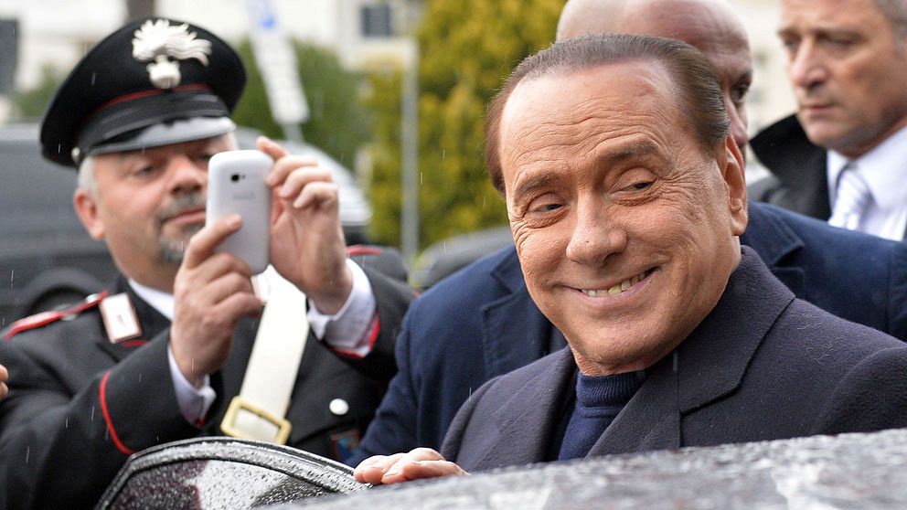 (FILES) – In this file picture taken on March 25, 2014, former Italian Prime Minister Silvio Berlusconi arrives at the Ciampino Airport. An Italian appeal court on July 18, 2014 acquitted former prime minister Silvio Berlusconi of charges of having sex with an underage prostitute and abuse of power. 'The defendant is acquitted,' presiding judge Enrico Tranfa said, rejecting a request from prosecutors to confirm a seven-year sentence against the billionaire tycoon. AFP PHOTO / ANDREAS SOLARO