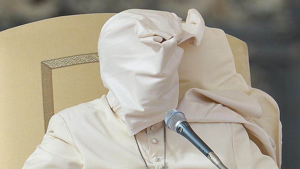 The pellegrina of Pope Francis is lifted by a gust of wind during his weekly general audience at St Peter's square on November 5, 2014 at the Vatican.