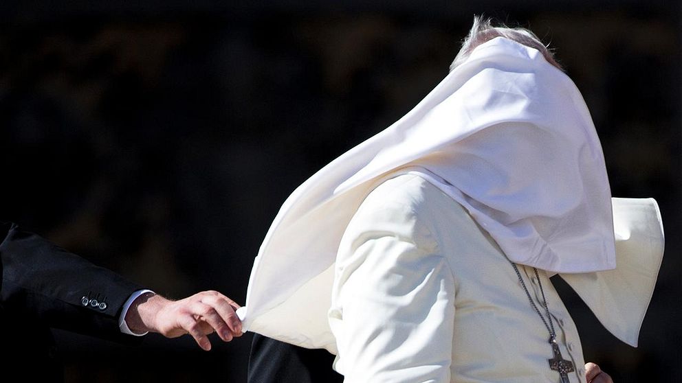 A gust of wind blows Pope Francis mantle as he leaves St. Peter's Square at the Vatican after his weekly general audience, Wednesday, Oct. 22, 2014. (AP Photo/Andrew Medichini)